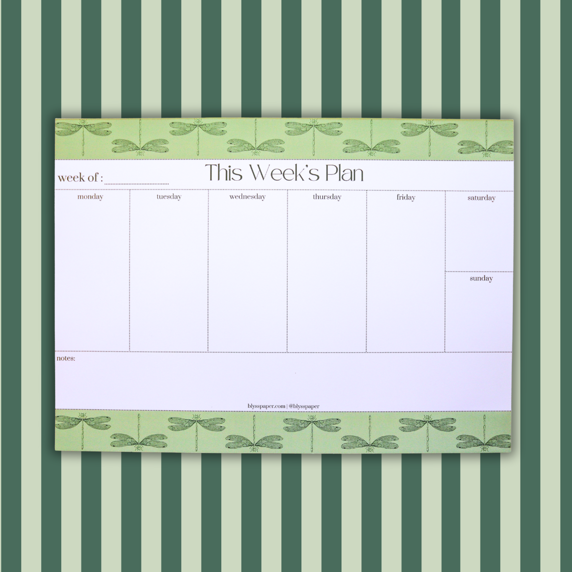 Weekly planner with dragonfly design on a striped green and white background